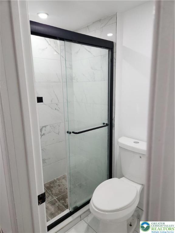 201 Ridge Avenue, Unit 3B Allentown, PA 18102 - Photo 12 of 12 a bathroom with a toilet and a shower