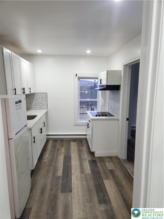 201 Ridge Avenue, Unit 3B Allentown, PA 18102 - Photo 6 of 12 a kitchen with white cabinets and white appliances