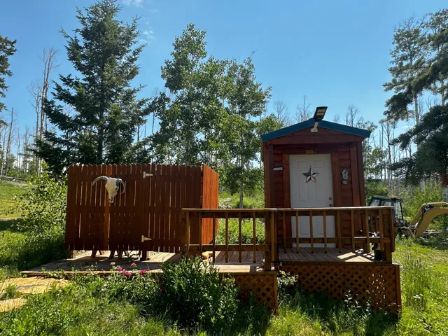 a view of a deck with a table and chairs