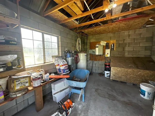 a room with lots of furniture and a window