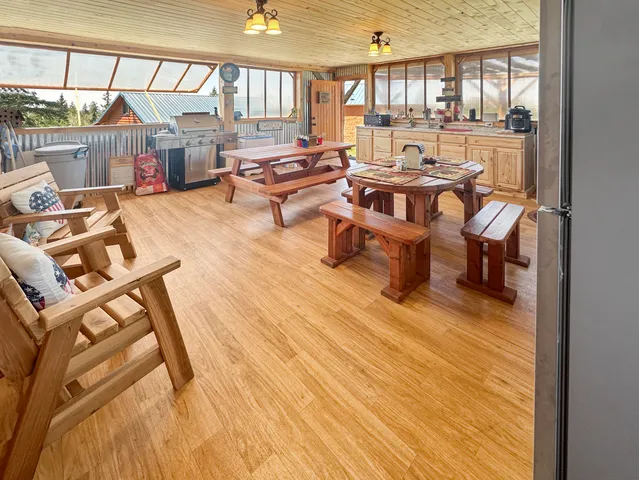 a living room with lots of furniture and a wooden floor