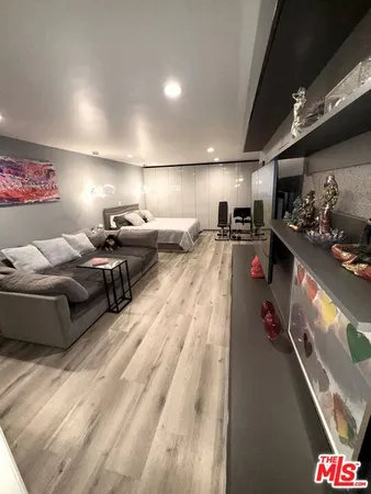 a bed room with bed and a flat screen tv