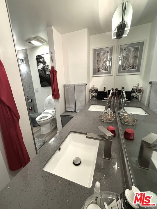 843 4th Street, Unit 207 Santa Monica, CA 90403 - Photo 14 of 49 a living room with furniture and a flat screen tv