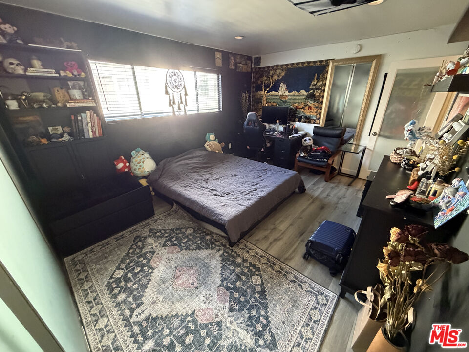 843 4th Street, Unit 207 Santa Monica, CA 90403 - Photo 21 of 49 a living room with furniture and a flat screen tv