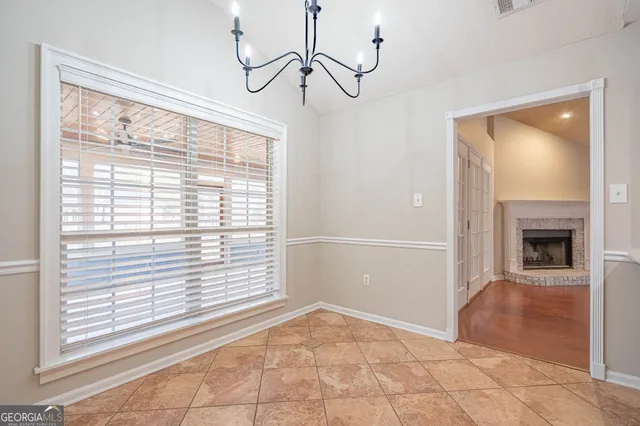 a kitchen with stainless steel appliances granite countertop a sink and a refrigerator