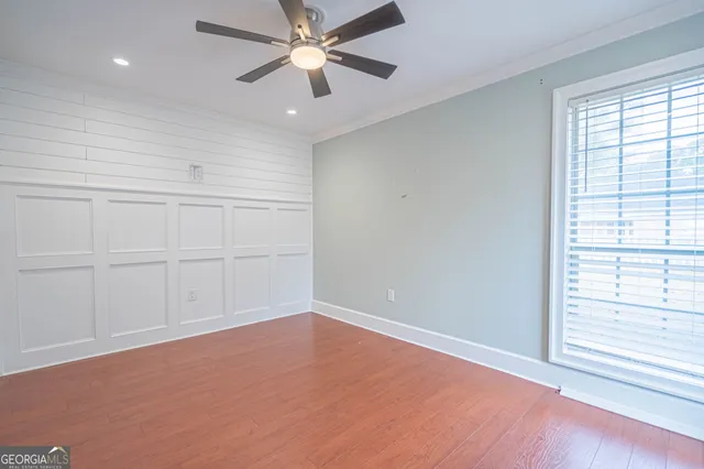 a bathroom with a toilet a sink and a mirror