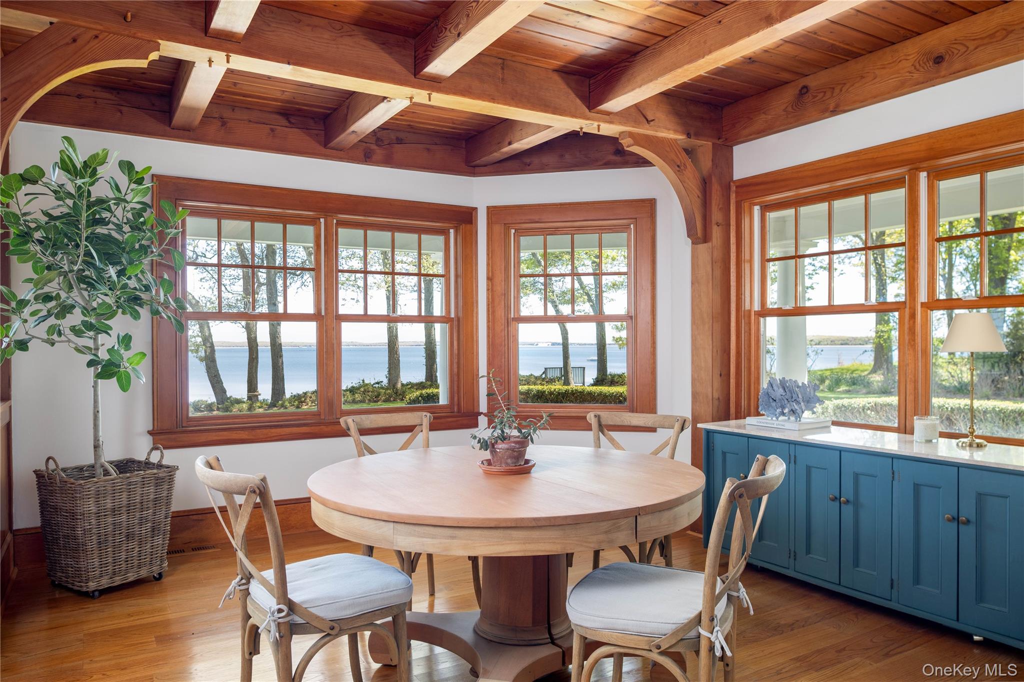 5055 New Suffolk Road New Suffolk, NY 11956 - Photo 15 of 42 a view of a dining room with furniture window and wooden floor