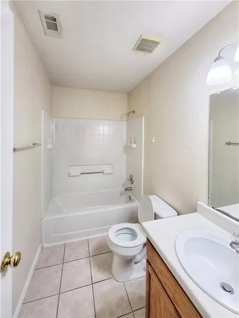 a bathroom with a sink a toilet and a bathtub