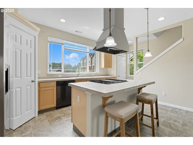 a view of hallway with a large mirror and a window