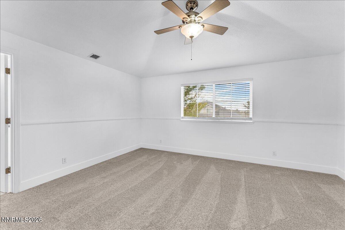 2329 Red Maple Court Reno, NV 89523 - Photo 27 of 39 an empty room with a window and ceiling fan