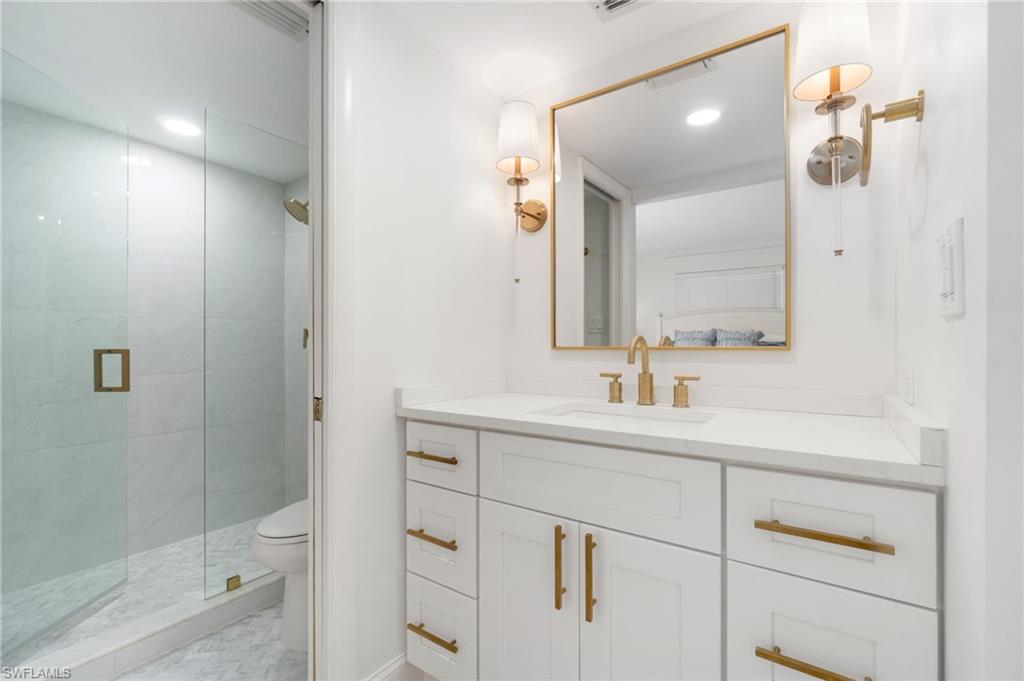 1222 Gordon Drive, Unit 2 Naples, FL 34102 - Photo 12 of 24 Full bath with vanity, a shower stall, and recessed lighting