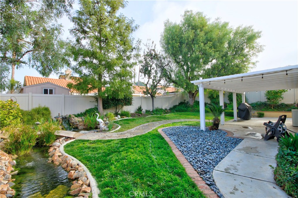 27536 Swallow Court Temecula, CA 92591 - Photo 39 of 55 a view of a house with backyard sitting area and garden