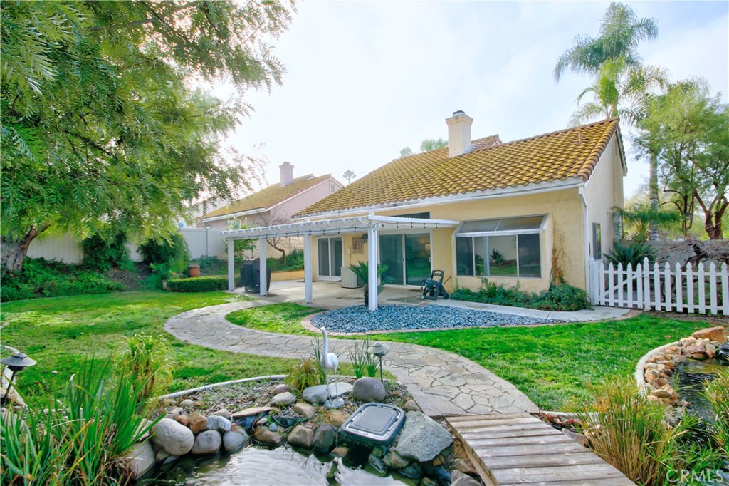 27536 Swallow Court Temecula, CA 92591 - Photo 40 of 55 a front view of a house with garden