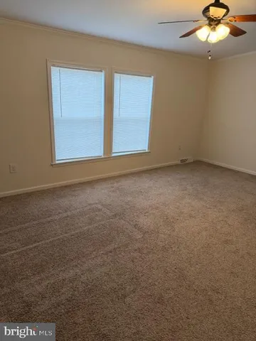 an empty room with a empty space and a window