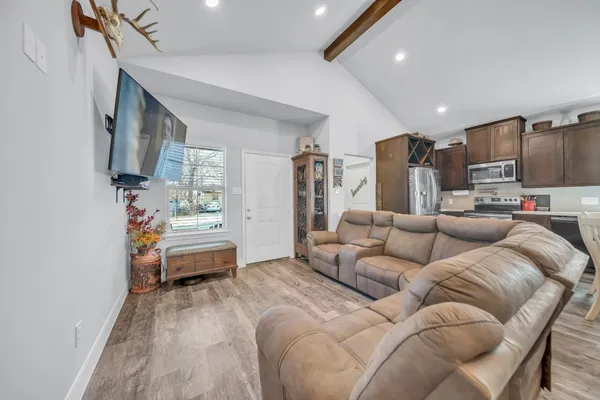 a kitchen with granite countertop wooden cabinets and stainless steel appliances