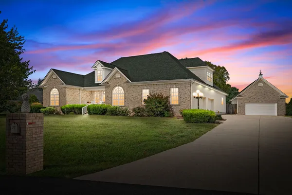 a front view of a house with a yard