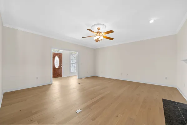 a view of a livingroom with wooden floor