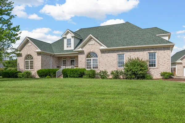 a front view of a house with a yard