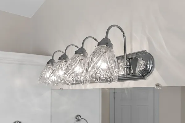 an empty room with a window and a ceiling fan