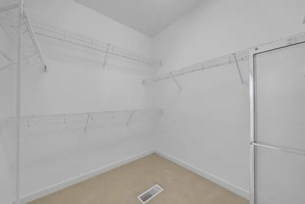 a view of storage and utility room with wooden floor