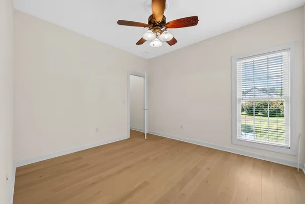 a view of a room with wooden floor