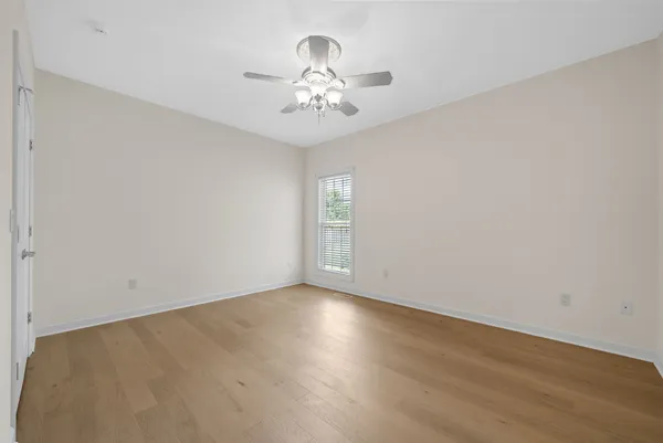 an aerial view of a residential houses with outdoor space and street view