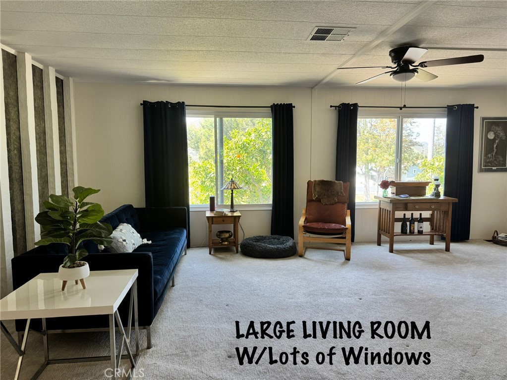 4650 Dulin Road, Unit 11 Fallbrook, CA 92003 - Photo 12 of 38 a living room with furniture and a large window