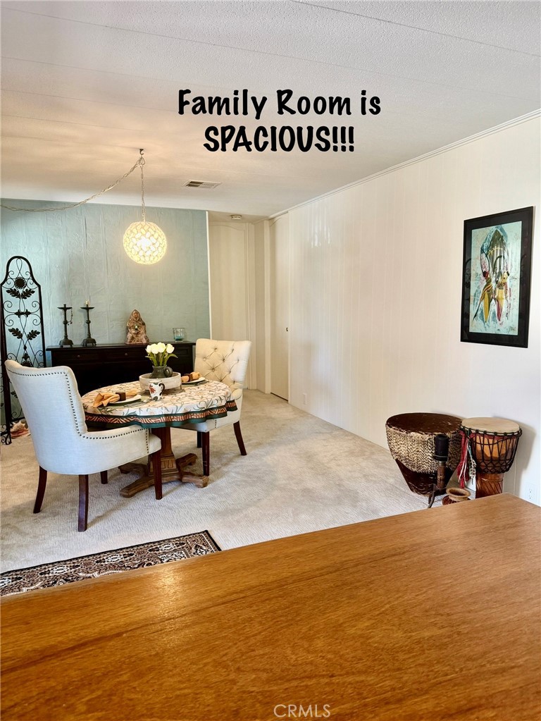 4650 Dulin Road, Unit 11 Fallbrook, CA 92003 - Photo 18 of 38 a living room with furniture and a rug