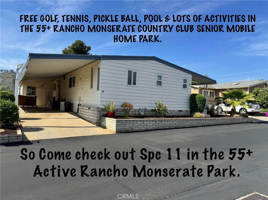 4650 Dulin Road, Unit 11 Fallbrook, CA 92003 - Photo 2 of 38 a front view of a house with a garden