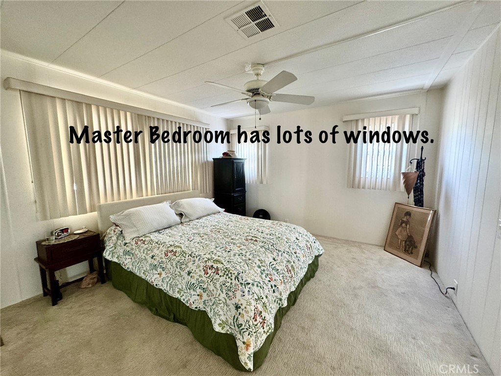 4650 Dulin Road, Unit 11 Fallbrook, CA 92003 - Photo 21 of 38 a bedroom with a bed and a window