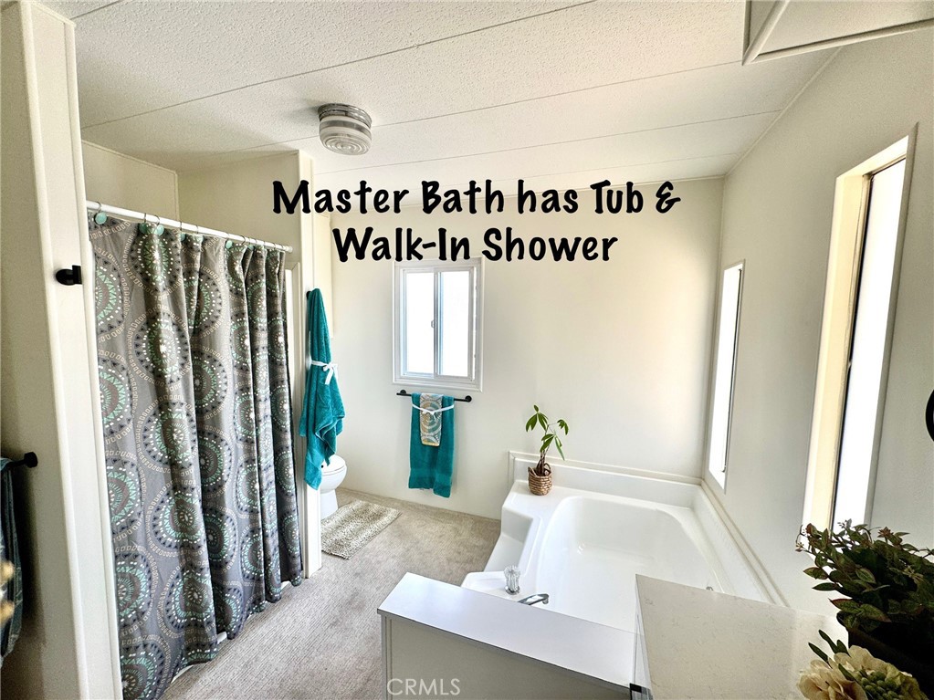 4650 Dulin Road, Unit 11 Fallbrook, CA 92003 - Photo 24 of 38 a bathroom with a bathtub and a sink