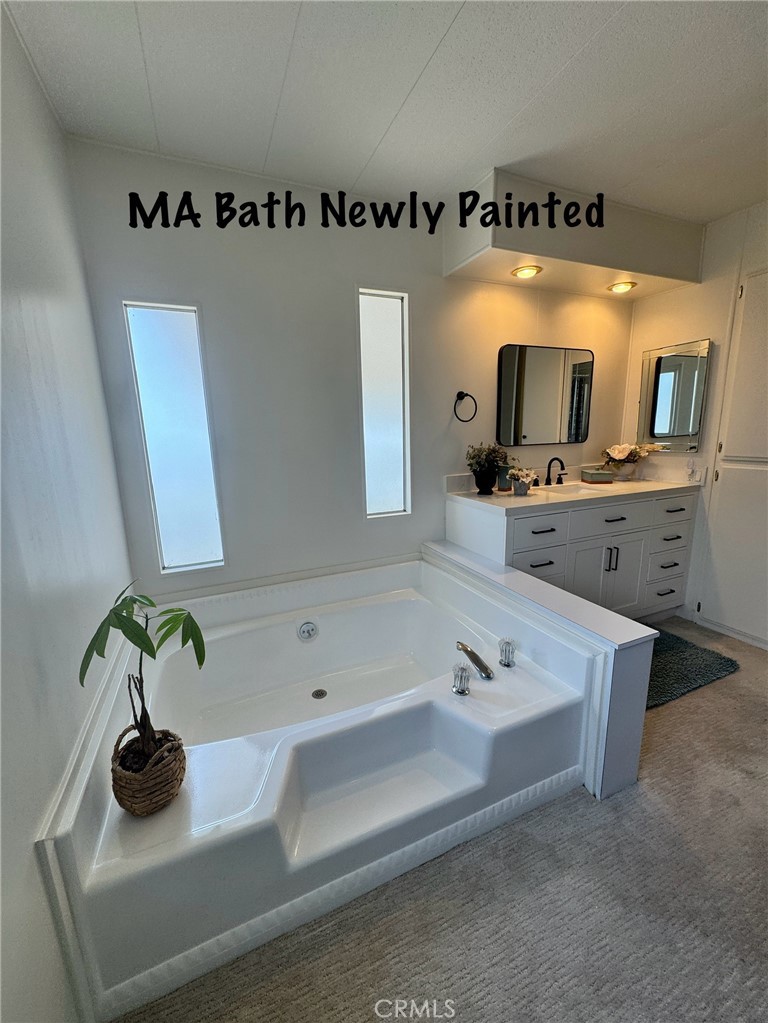 4650 Dulin Road, Unit 11 Fallbrook, CA 92003 - Photo 25 of 38 a bathroom with a sink and a mirror