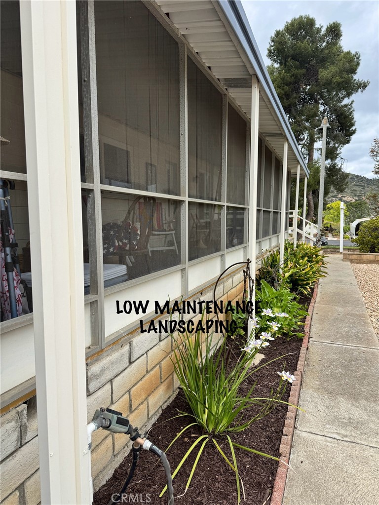 4650 Dulin Road, Unit 11 Fallbrook, CA 92003 - Photo 31 of 38 a front view of a house with garden