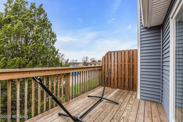 a view of balcony with wooden floor