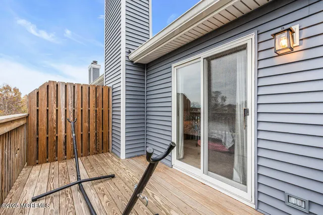 a view of balcony with wooden floor