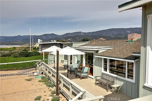 an outdoor space with furniture and garden view