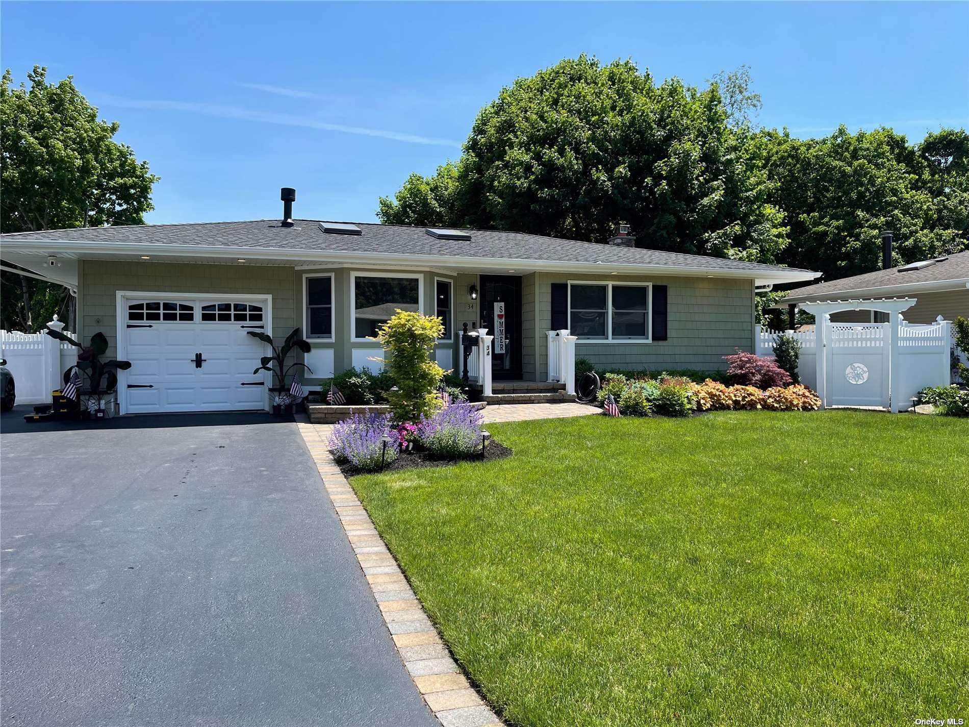 34 Copperbeech Road St. James, NY 11780 - Photo 1 of 1 a front view of house with yard and green space
