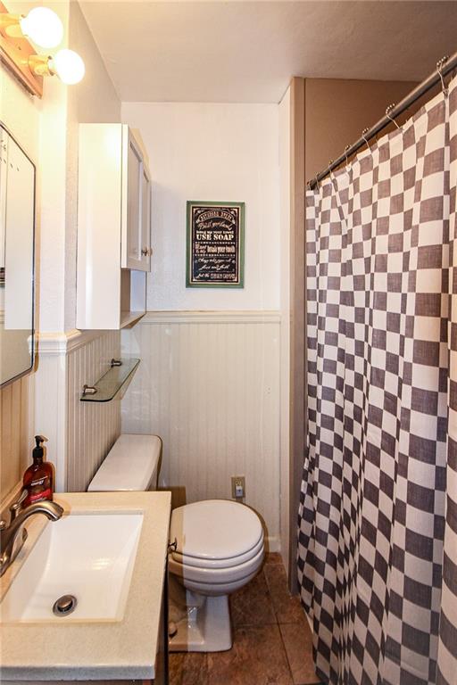 684 Elizabeth Street Bridgeville, PA 15017 - Photo 17 of 34 a bathroom with a toilet and a sink