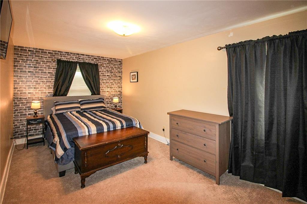 684 Elizabeth Street Bridgeville, PA 15017 - Photo 18 of 34 a view of a bedroom with furniture and window