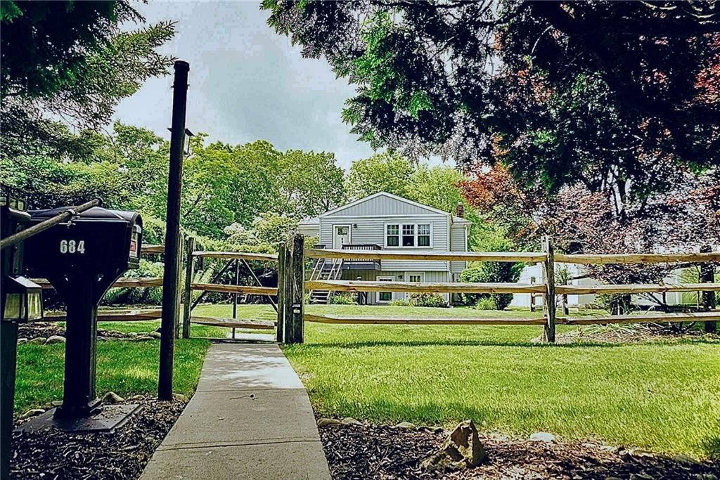 684 Elizabeth Street Bridgeville, PA 15017 - Photo 2 of 34 a front view of a house with a yard