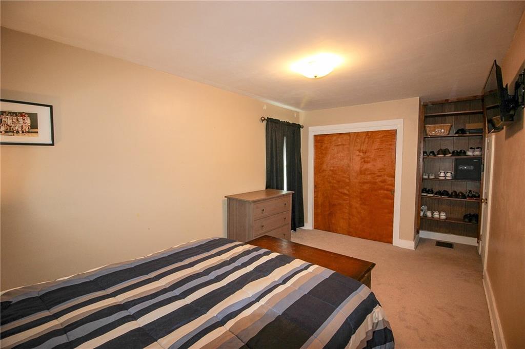 684 Elizabeth Street Bridgeville, PA 15017 - Photo 21 of 34 a bedroom with a bed and a window