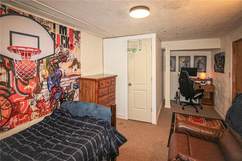 684 Elizabeth Street Bridgeville, PA 15017 - Photo 23 of 34 a bedroom with a bed and a window
