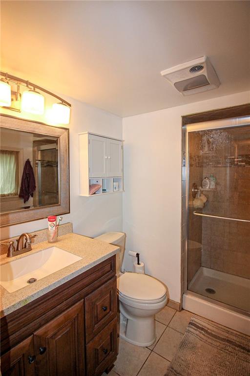 684 Elizabeth Street Bridgeville, PA 15017 - Photo 25 of 34 a bathroom with a sink a toilet and shower