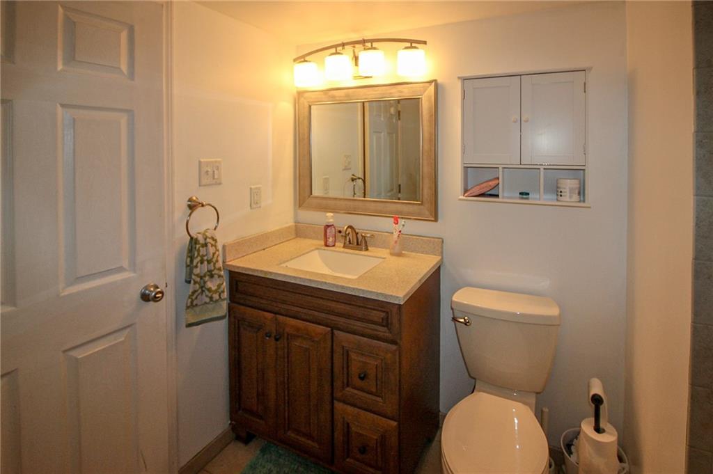 684 Elizabeth Street Bridgeville, PA 15017 - Photo 26 of 34 a bathroom with a toilet sink and mirror
