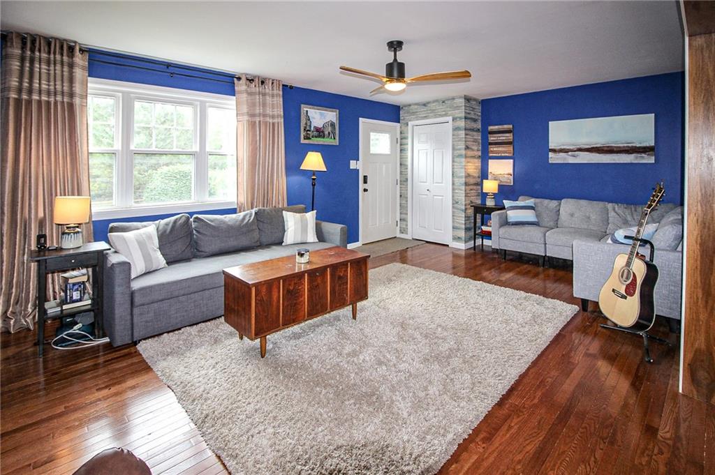 684 Elizabeth Street Bridgeville, PA 15017 - Photo 3 of 34 a living room with furniture and a large window