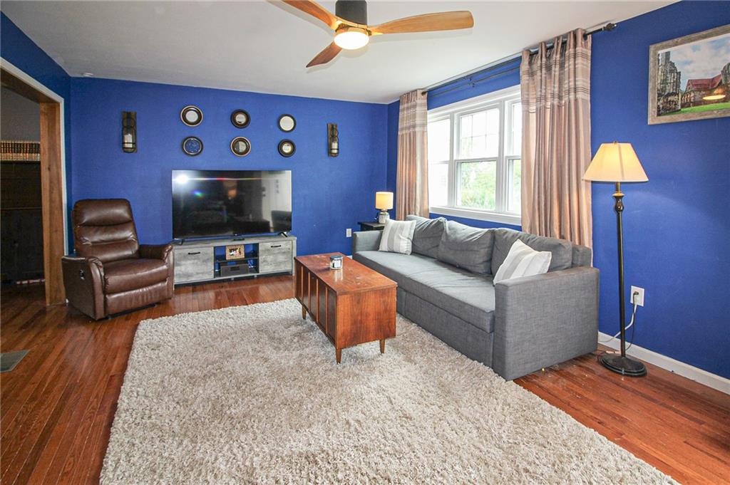 684 Elizabeth Street Bridgeville, PA 15017 - Photo 4 of 34 a living room with furniture and a flat screen tv