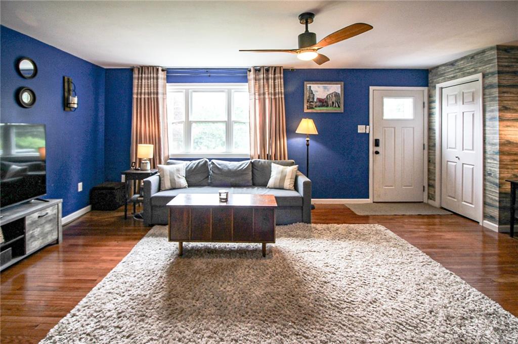 684 Elizabeth Street Bridgeville, PA 15017 - Photo 5 of 34 a living room with furniture and a flat screen tv