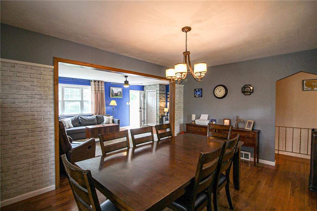 684 Elizabeth Street Bridgeville, PA 15017 - Photo 8 of 34 a view of a dining room with furniture window and wooden floor