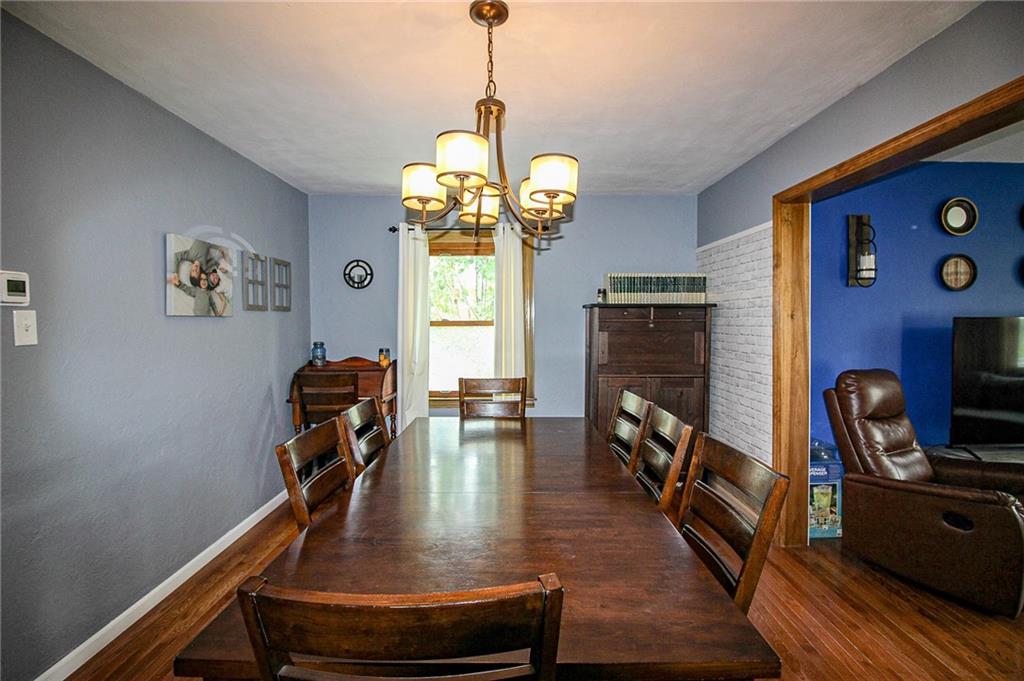 684 Elizabeth Street Bridgeville, PA 15017 - Photo 9 of 34 a view of a dining room with furniture and wooden floor