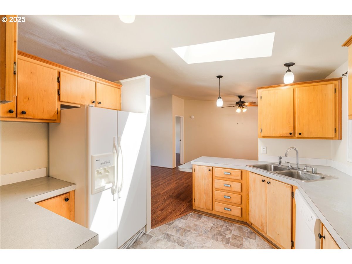 1819 Southeast Orient Drive, Unit 1 Gresham, OR 97080 - Photo 12 of 31 a kitchen with a sink a refrigerator and a stove